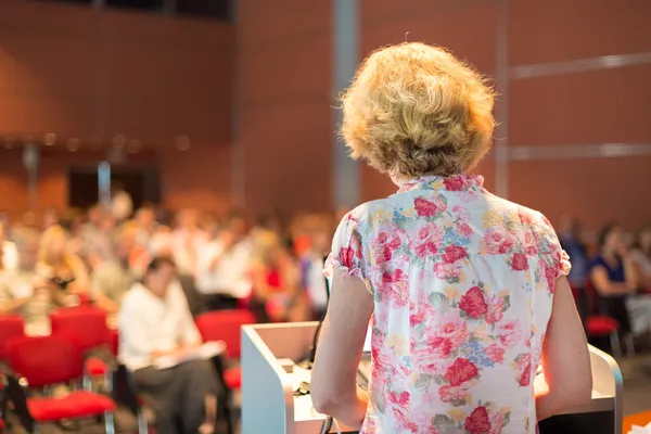 Female academic professor lecturing.