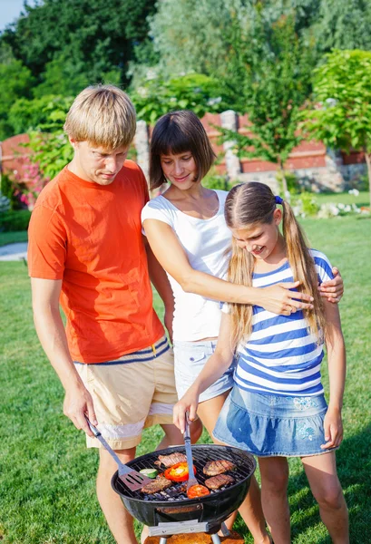 Family having barbecue