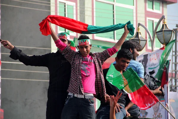 Political Supporters Dancing while attending a Rally