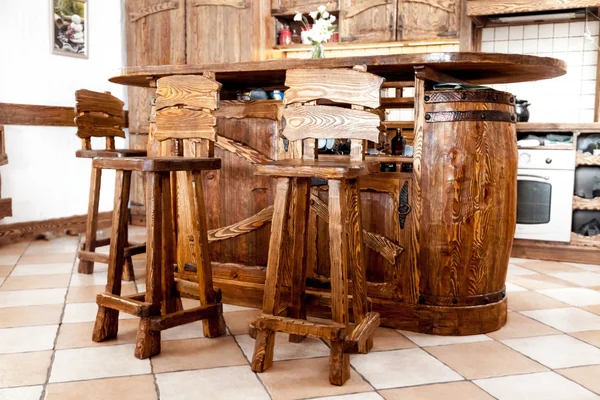 High wooden bar chairs standing near bar desk