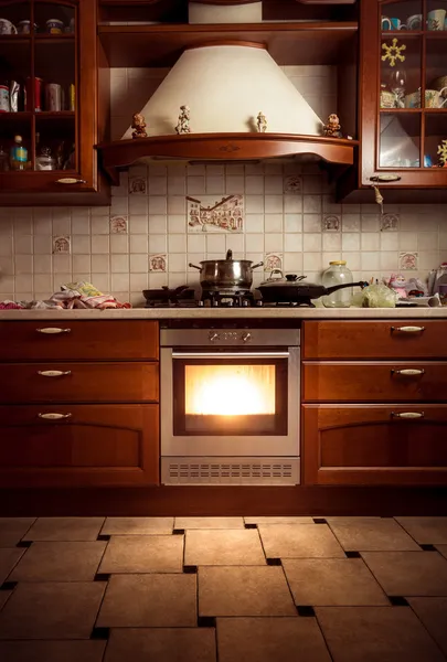 Photo of country style kitchen with hot oven