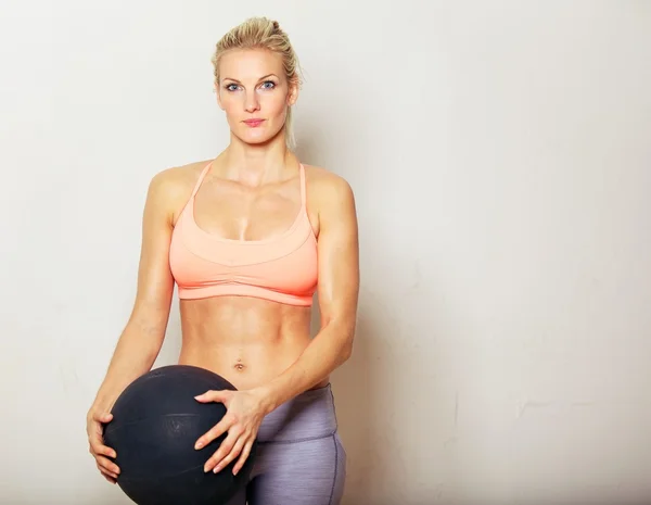 Woman Holding Exercise Ball
