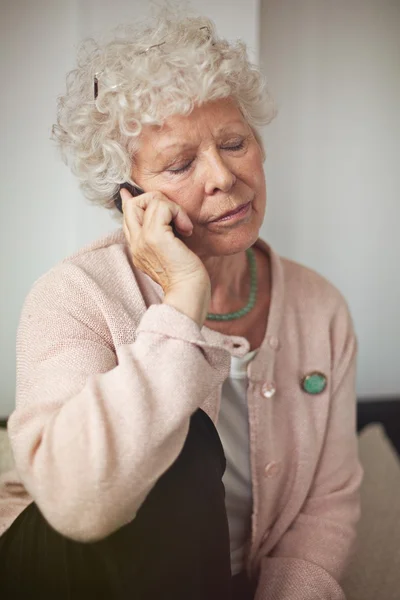 Grandmother Communicating Using a Cell Phone