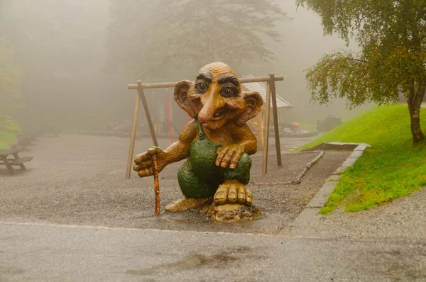 Statue of a Troll in a Norwegian Park in the Fog