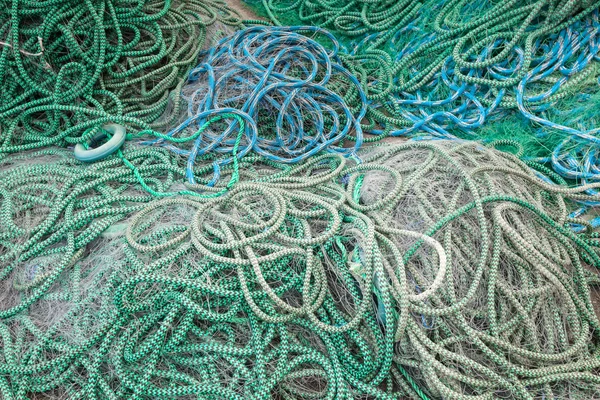 Background texture of fishing net drying on the sea coast in Norway