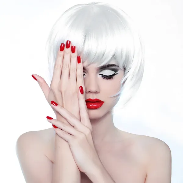 Makeup and Hairstyle. Red Lips and Manicured Nails. Fashion Beau