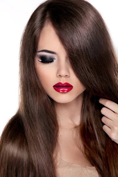 Beautiful Brunette Girl with Healthy Long Hair and Red Lips. Fa