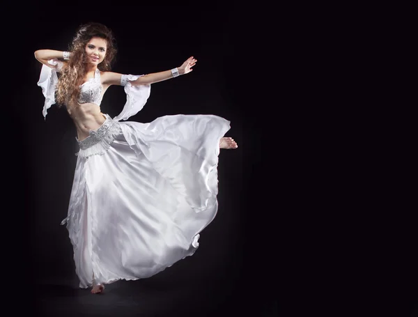 Beauty Girl belly dancer in white suit oriental dance in motion