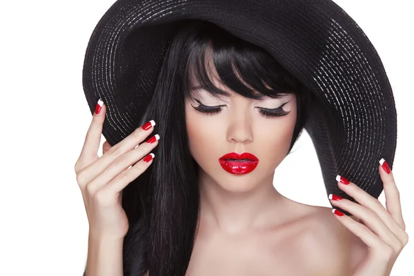 Beauty fashion sexy girl portrait in black hat. Red lips and pol