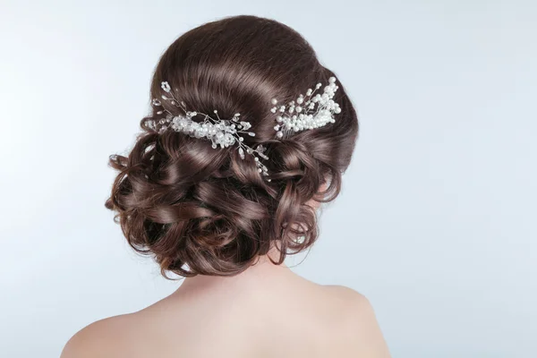 Beauty wedding hairstyle. Bride. Brunette girl with curly hair s