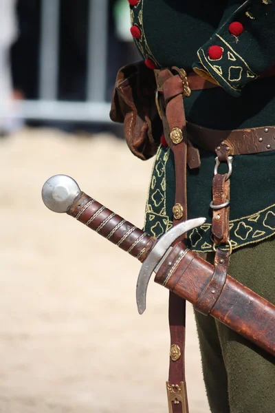 Close up of man with sword sheath