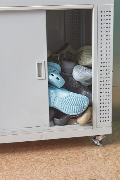 Shoes in cabinet