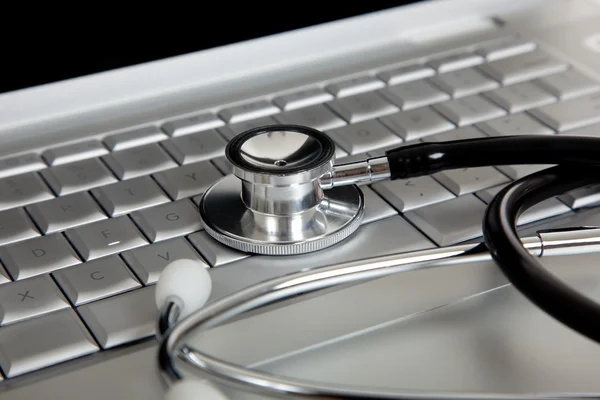 Stethoscope on a Laptop Computer — Stock Photo #13385441
