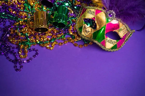 Assorted Mardi Gras or Carnivale mask on a purple background