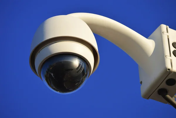 Hi-tech dome type camera over a blue sky