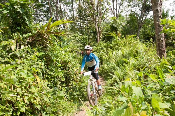 YALA, THAILAND - APRIL 1: Unidentified boy rides mountain bike f