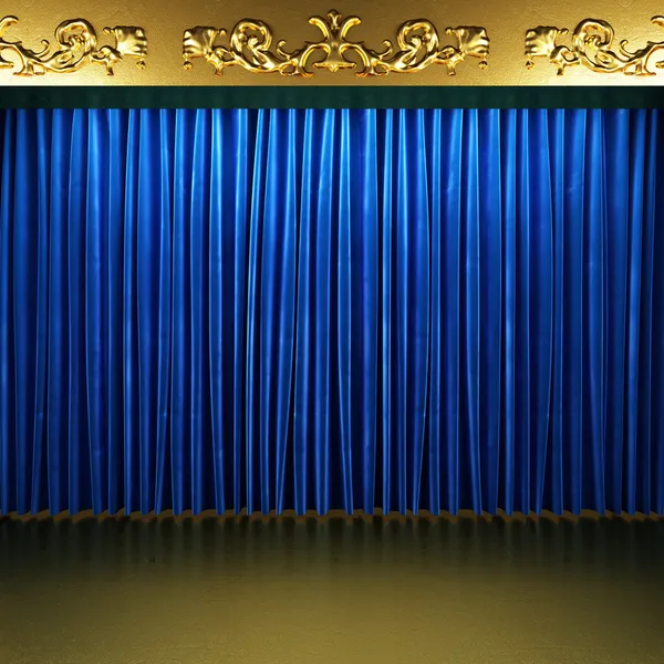 Blue fabric curtain with gold on stage