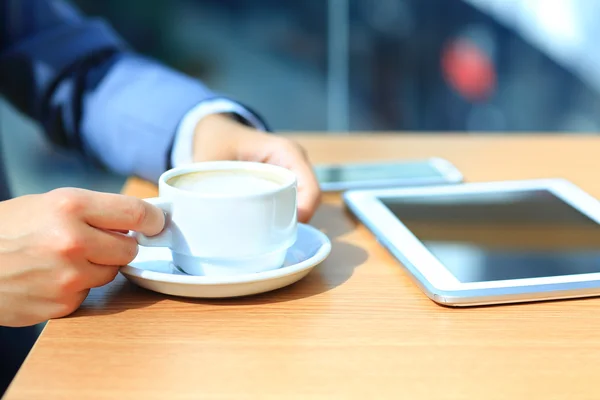 Businessman using digital tablet computer with modern mobile phone. New technologies for success workflow concept.