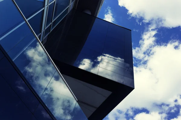 Detail of building with reflection of clouds