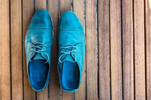 Man shoes on wooden background