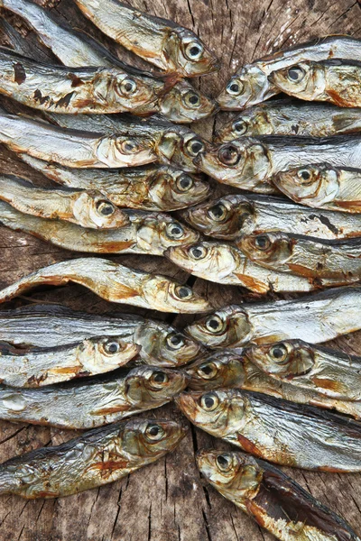 Plenty of small dried fishes on a stack