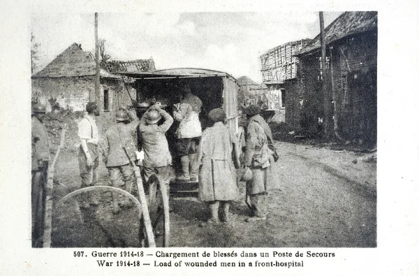 Old postcard of the war of 14, loading of wounded in a rescue station