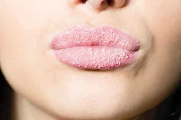 Closeup on female sweet candy sugar lips kiss