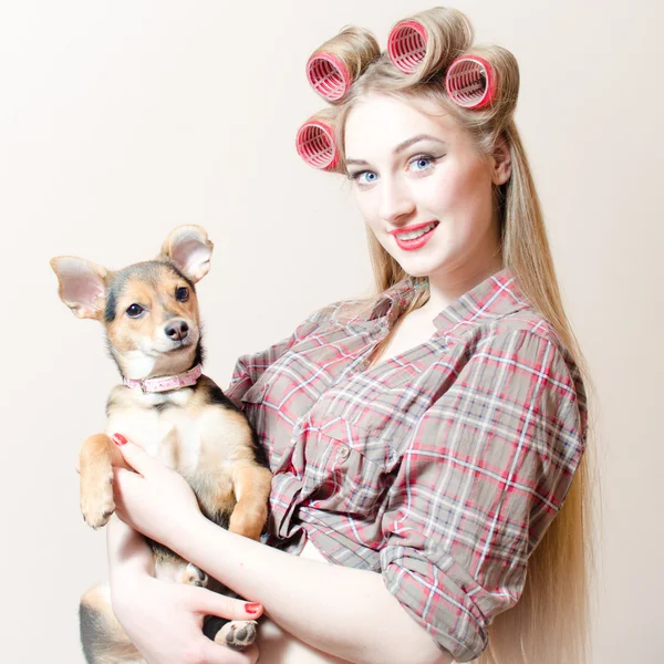 Beautiful woman  holding a small dog