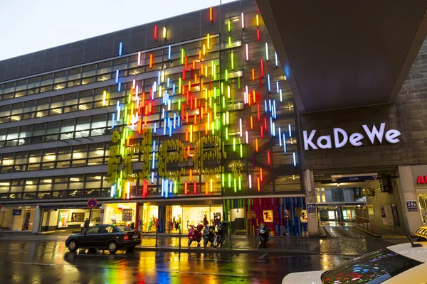 BERLIN - APRIL 4: The famous shopping street Kurfuerstendamm with KADEWE in neon lights on April 4, 2012 in Berlin, Germany. The Kurfurstendamm, is one of the most popular German shopping streets.