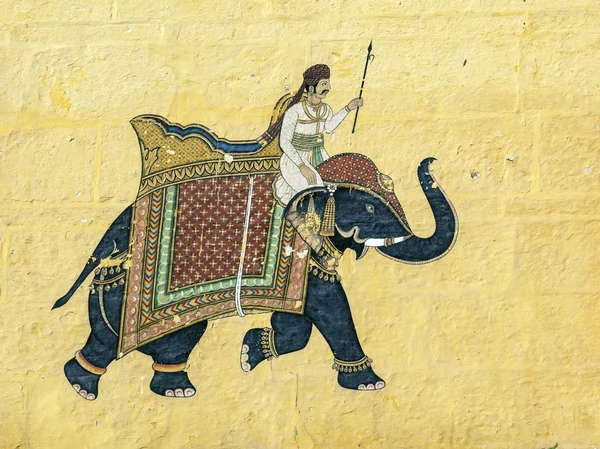 Colorful indian mural in the fort at Jodhpur showing a royal pro