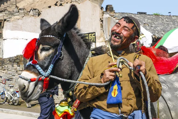 Laughing man with old pipe