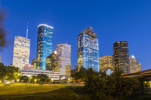 View on downtown Houston by night with bridges in colorful light