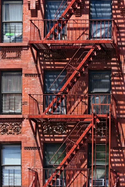 Fire ladder at old houses downtown in New York — Stock Photo #30132611