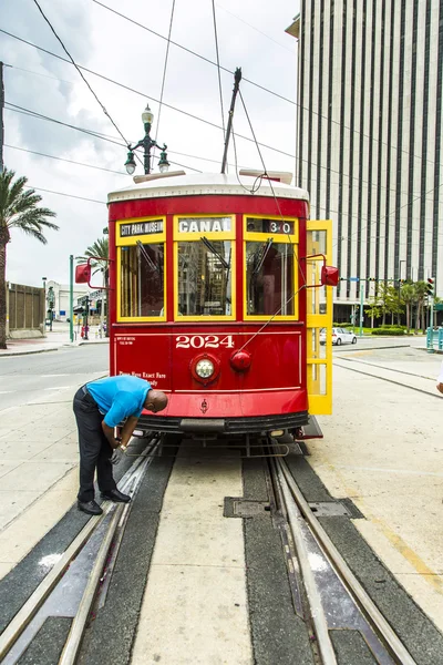 Operator works on the streetcar at Canal street