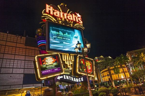 Entrance of  Harrahs casino and hotel in Las Vegas by night