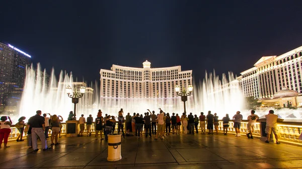 People watch famous Bellagio Hotel with water games in Las Vegas