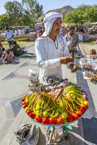 Street seller selling bananas and other fruits in Jaipur