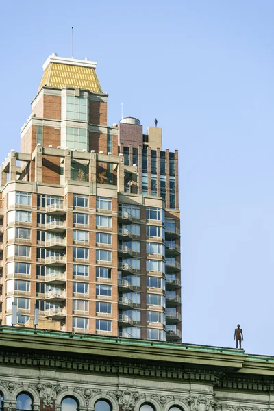 Statue of Man from artist Antony Gormley on the roof