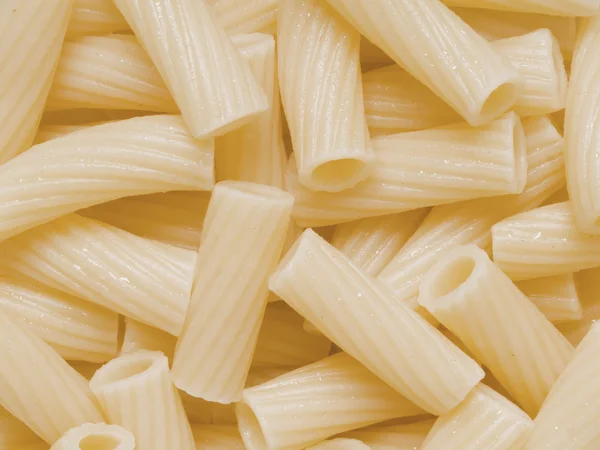 Cooked maccheroni pasta tubes food texture background