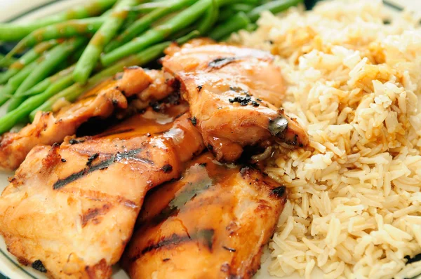 Grilled chicken thighs with peanut sauce, fresh green beans and