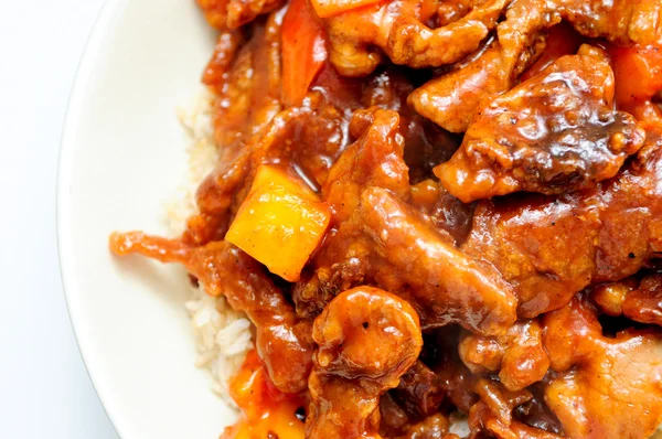 Sweet and sour pork, a chinese take out food with pineapple
