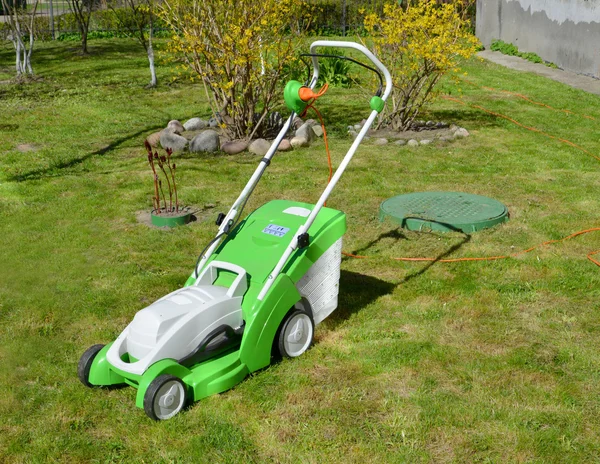 Lawn-mower complete with the container for a grass
