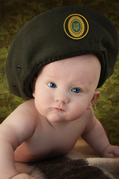 Small boy in a military cap