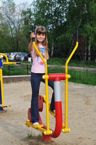 Girl on elliptical trainer
