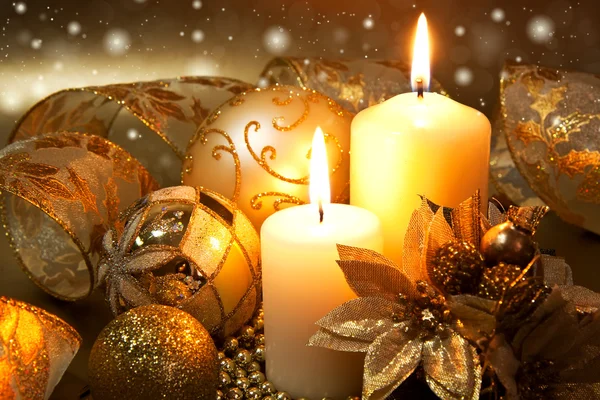 Christmas decoration with candles over dark background