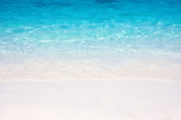 Wave of the sea on the sand beach