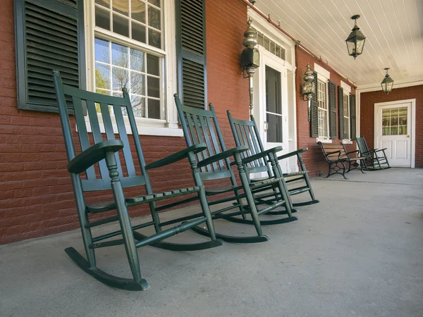 Rocking chairs on historic New England house