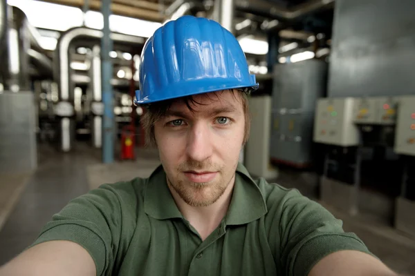 Young engineer in a power plant