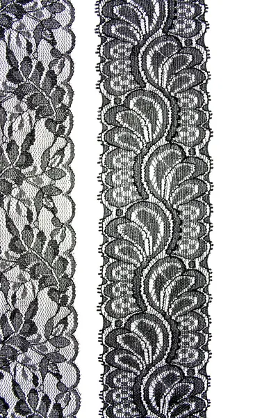 Black lace with pattern in the manner of flower on white backgro