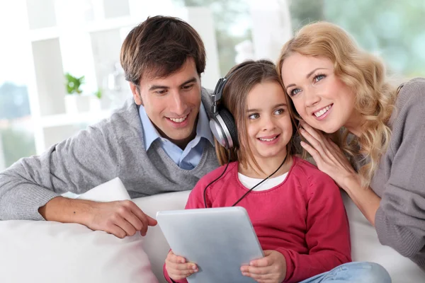 Family listening to music with tablet — Stock Photo #13932658